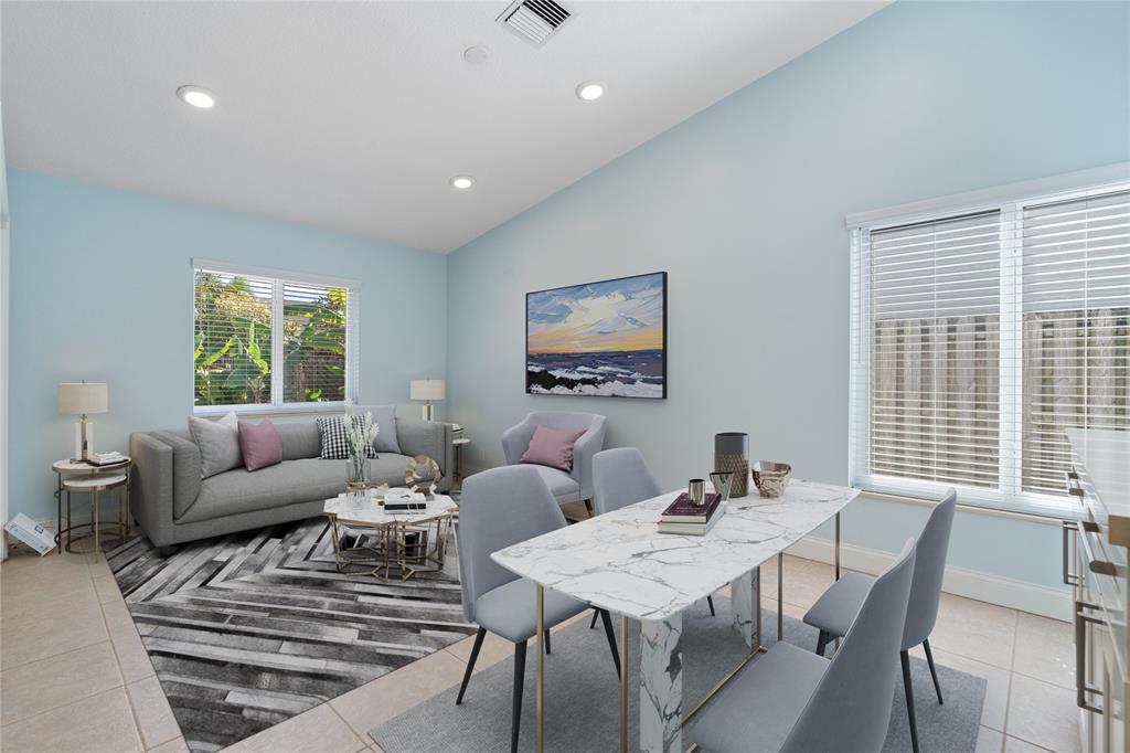 3240 Northwest 106th Avenue Sunrise, FL 33351 - Photo 7 of 21 a view of a dining room with furniture window and outside view