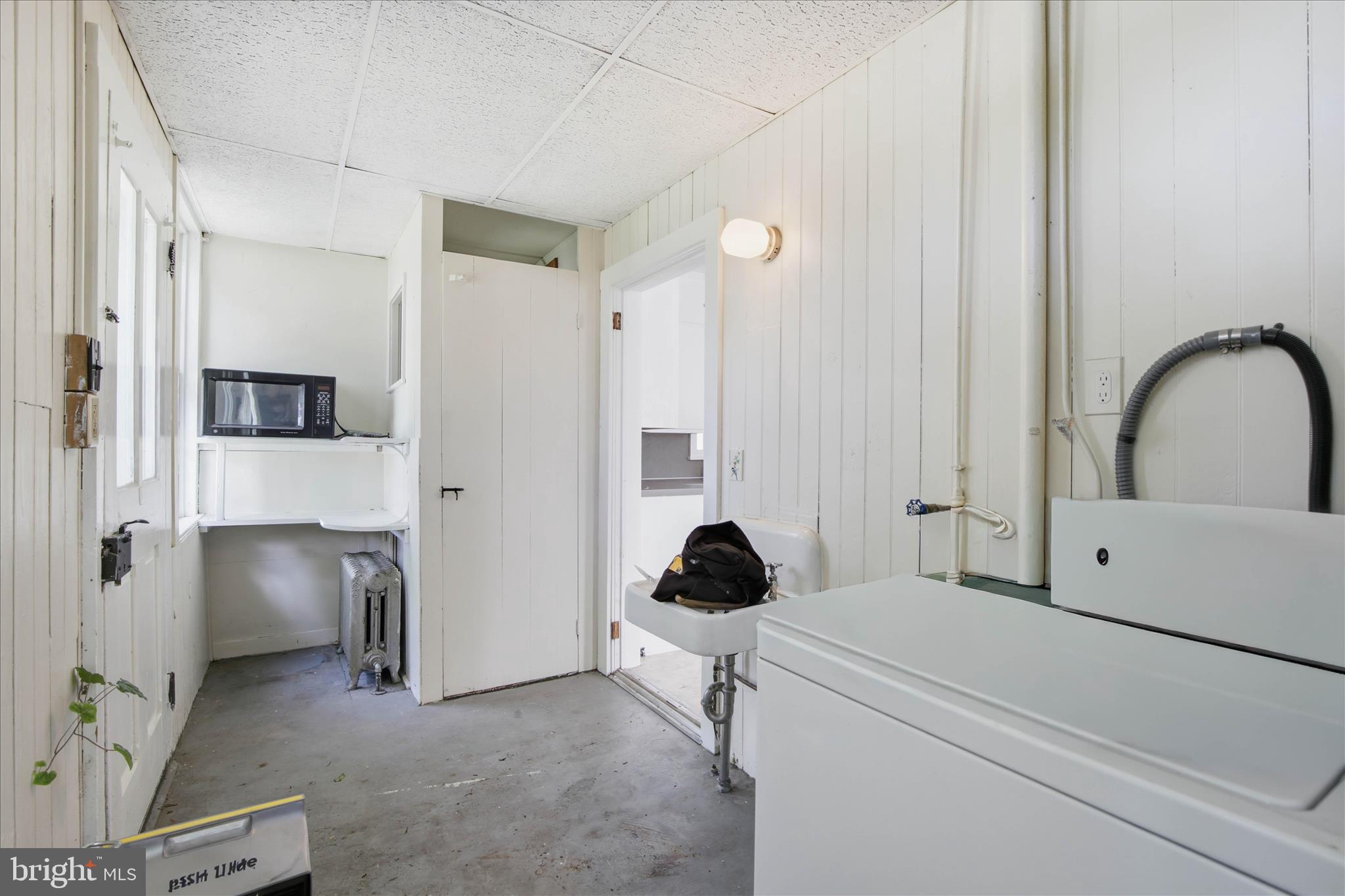 101 East Lincoln Avenue Lititz, PA 17543 - Photo 9 of 39 a room with a chair and a washer dryer