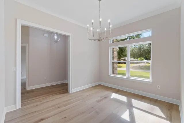 a view of hallway with wooden floor