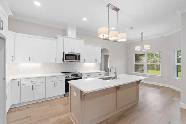 a bathroom with a double vanity sink and mirror