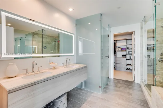 a bathroom with a bathtub and a shower