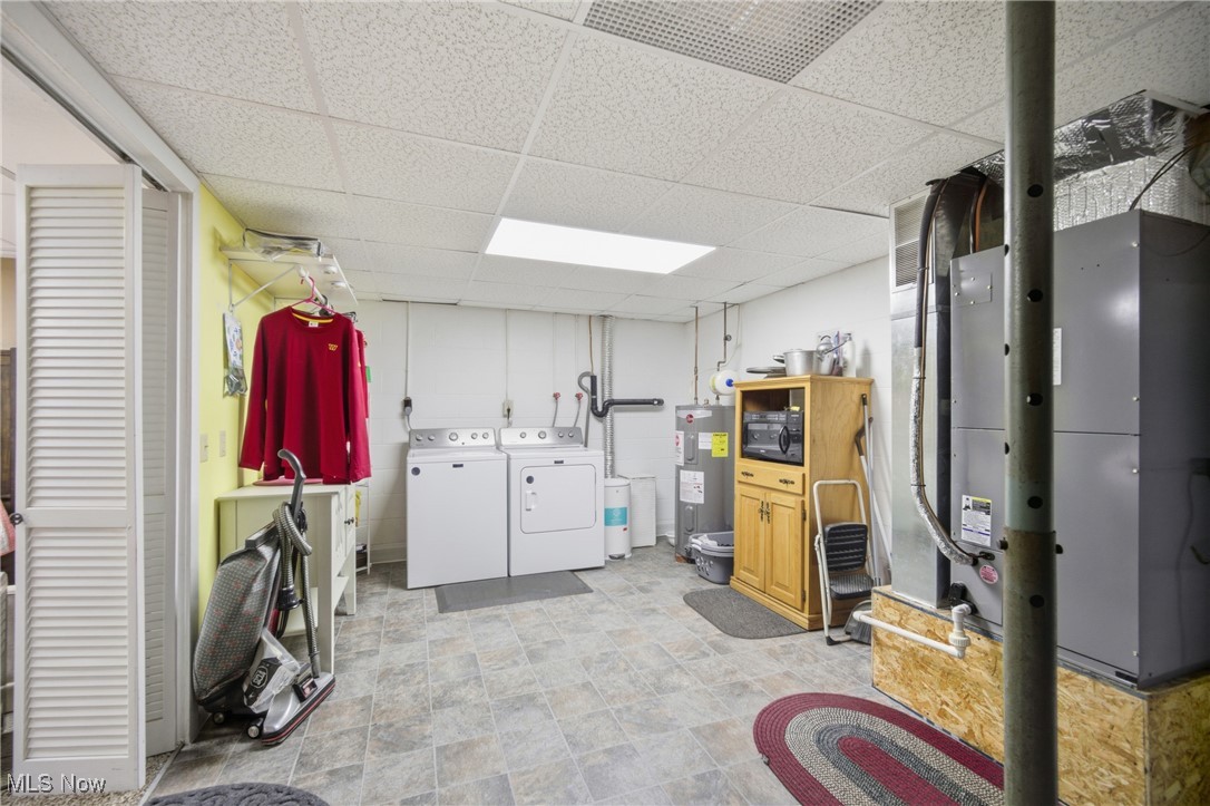 1788 Ashby Ridge Road Parkersburg, WV 26104 - Photo 30 of 46 Finished basement with a drop ceiling, washing machine and dryer, water heater, and heating unit