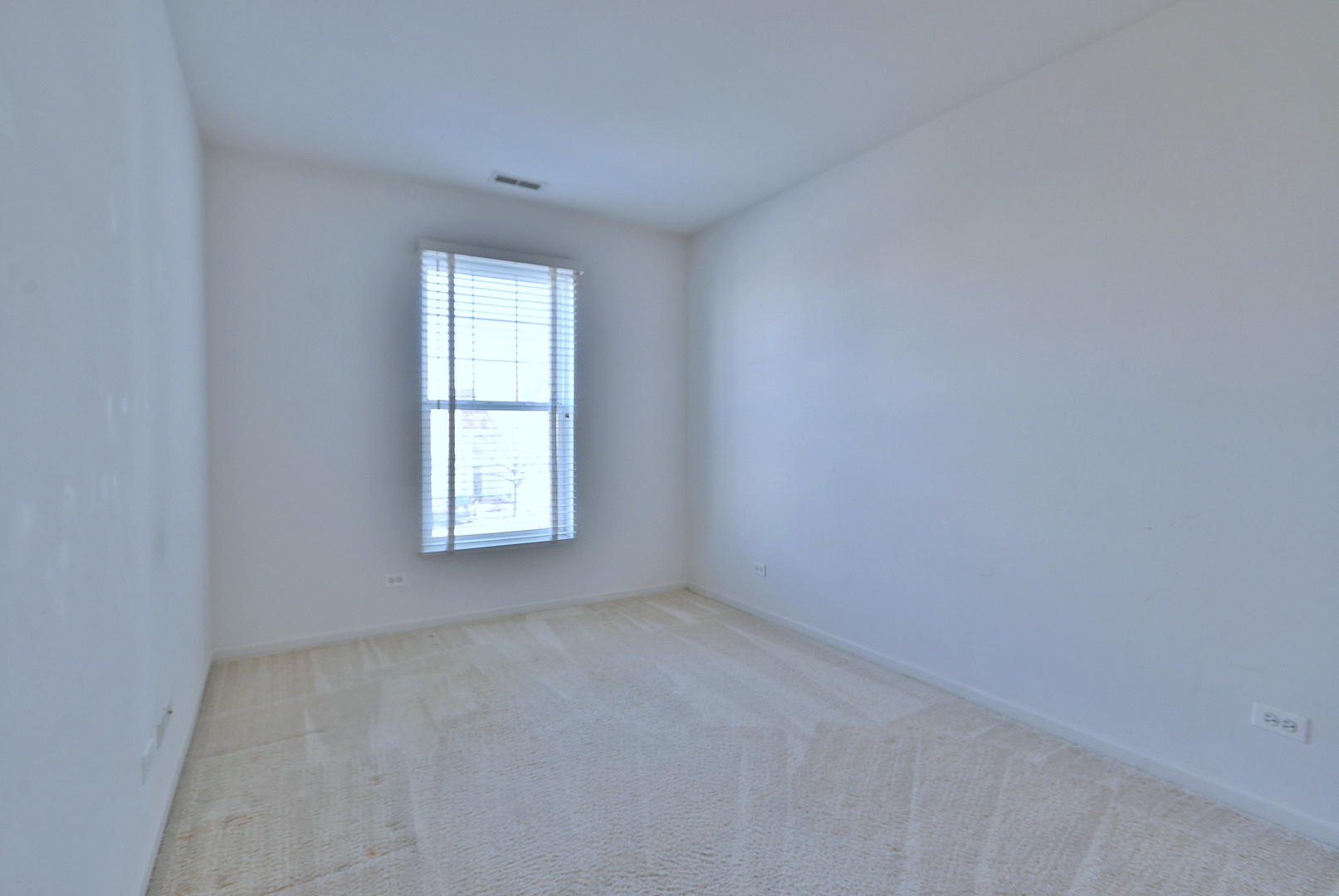 1202 Delta Drive Elgin, IL 60123 - Photo 20 of 23 an empty room with a window
