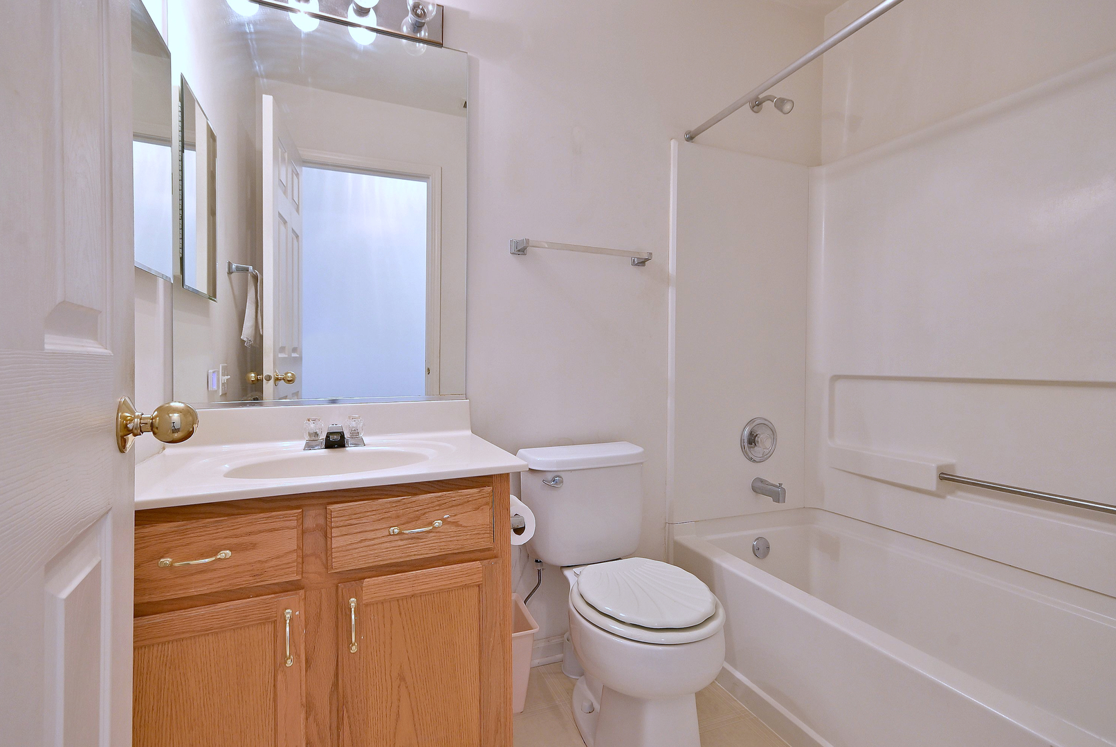 1202 Delta Drive Elgin, IL 60123 - Photo 22 of 23 a bathroom with a sink a toilet and shower