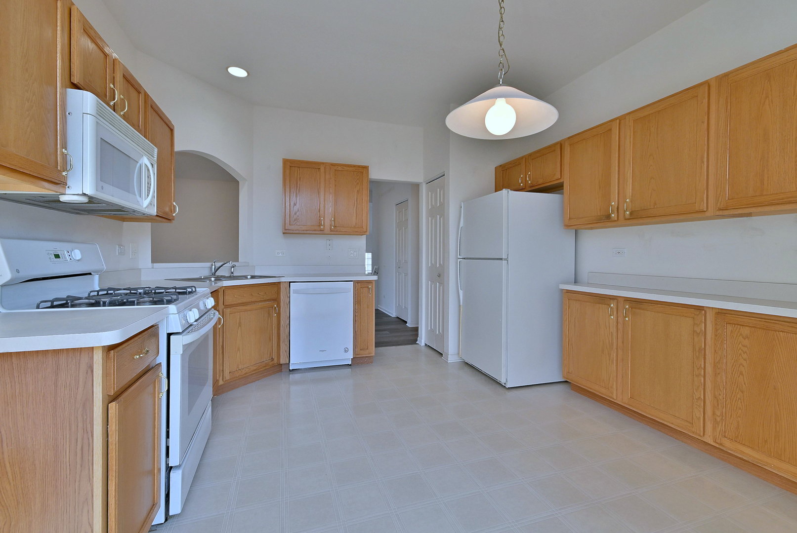 1202 Delta Drive Elgin, IL 60123 - Photo 5 of 23 a kitchen that has a lot of cabinets in it