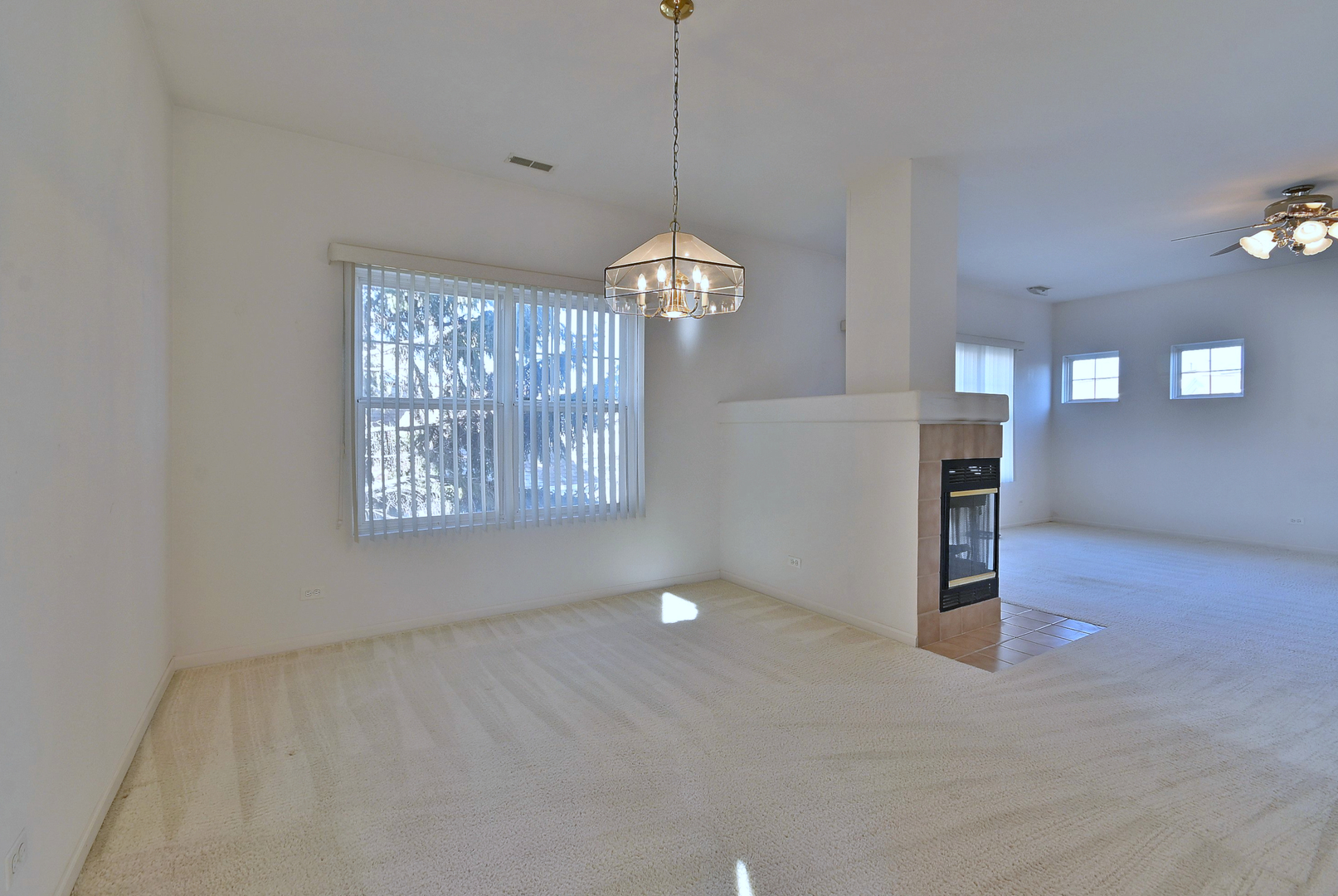 1202 Delta Drive Elgin, IL 60123 - Photo 7 of 23 a view of a room with window chandelier