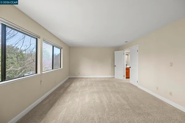 a view of an empty room with a window