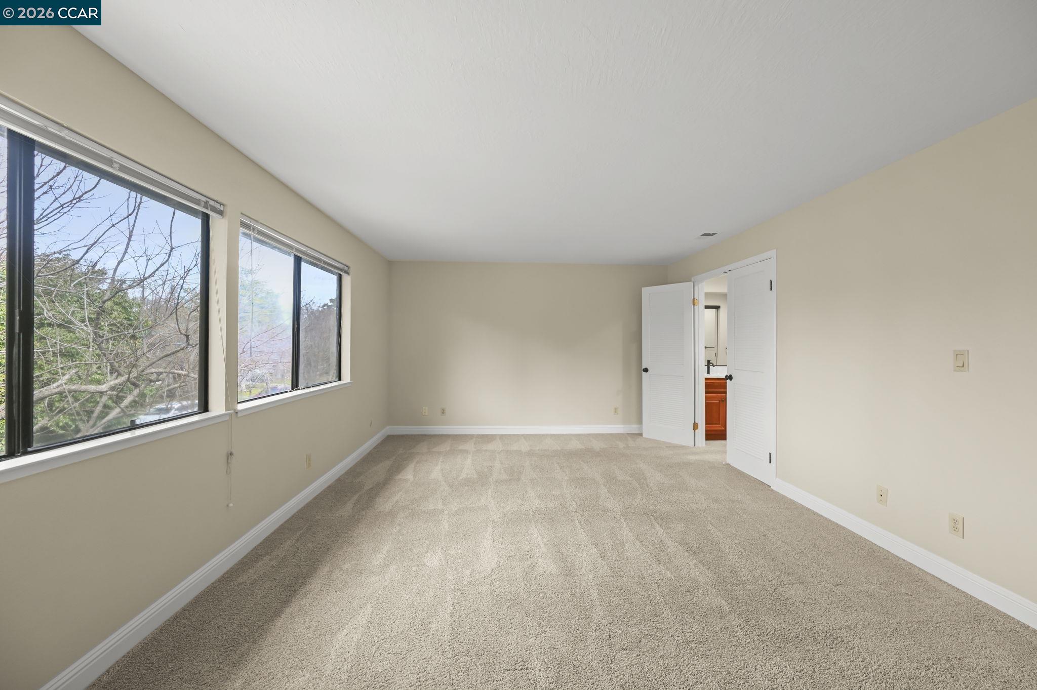 5017 Murchio Drive Concord, CA 94521 - Photo 17 of 30 a view of an empty room with a window