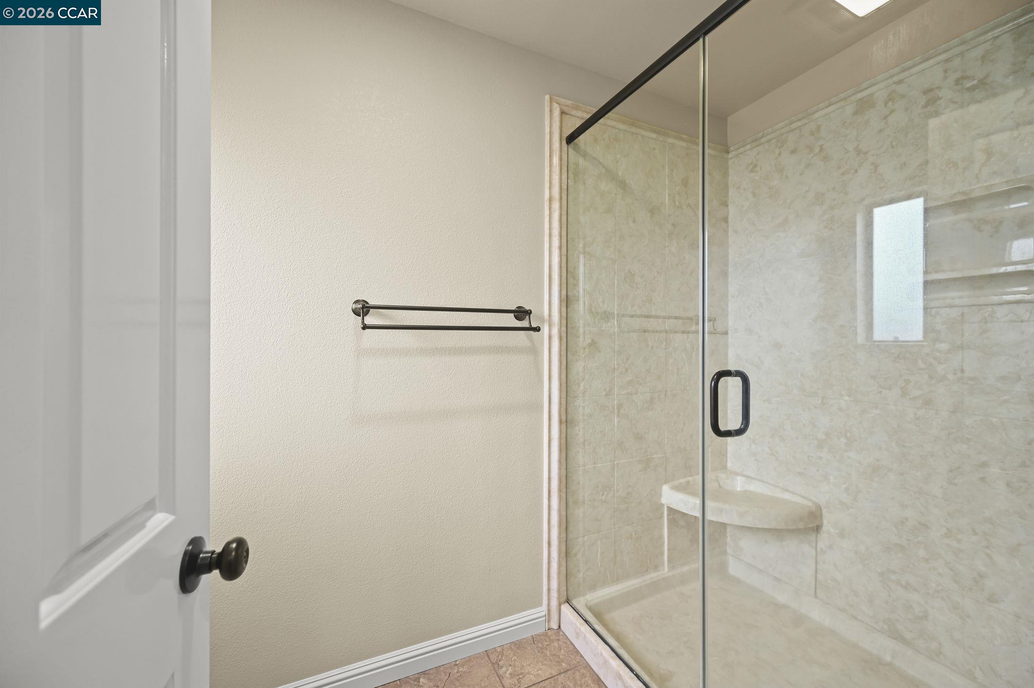 5017 Murchio Drive Concord, CA 94521 - Photo 19 of 30 a bathroom with a glass shower door