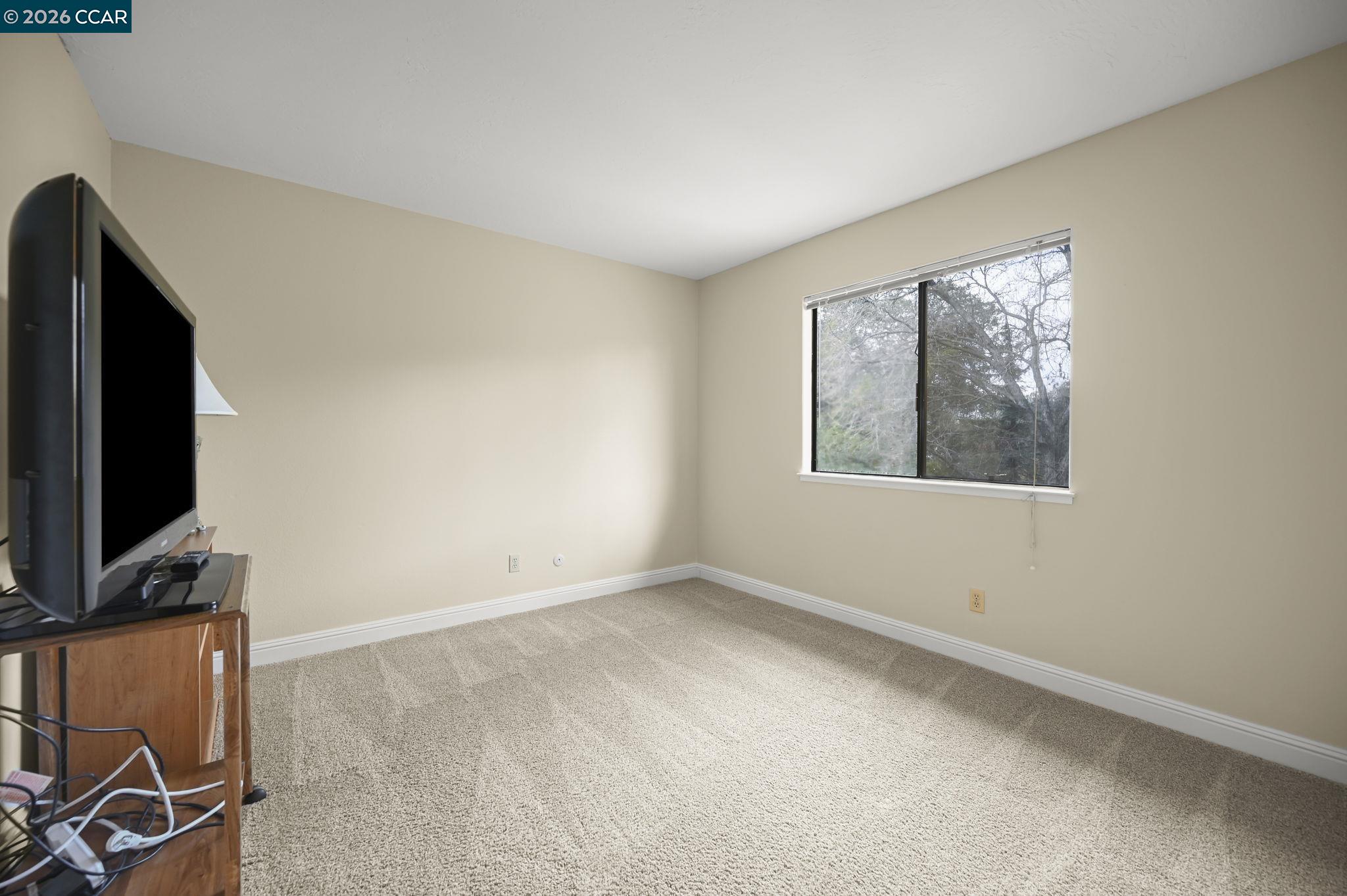 5017 Murchio Drive Concord, CA 94521 - Photo 21 of 30 an empty room with windows