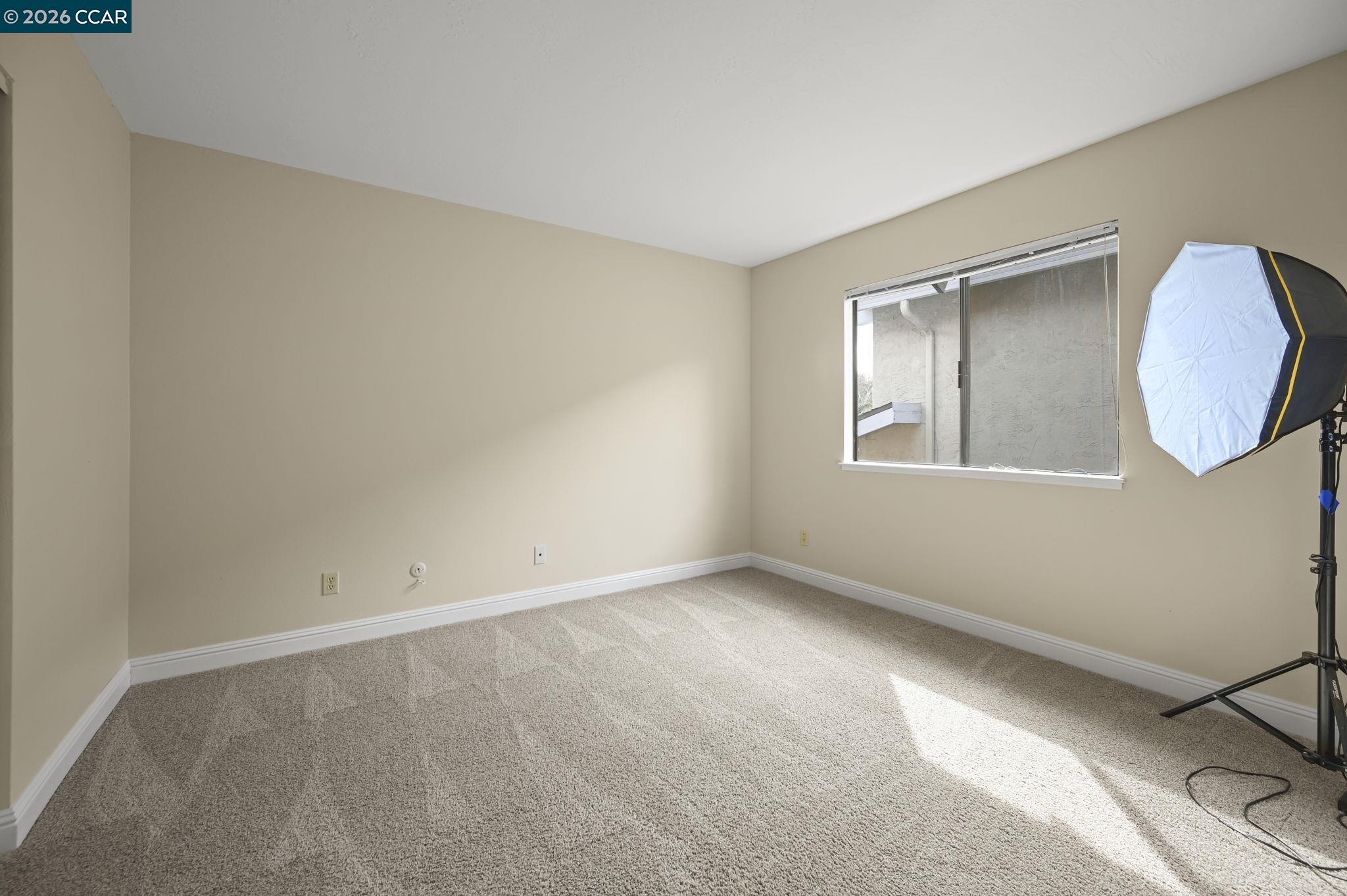 5017 Murchio Drive Concord, CA 94521 - Photo 23 of 30 an empty room with a window