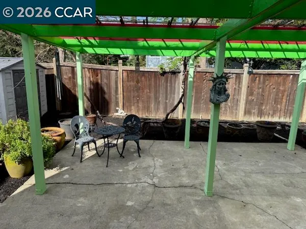 a patio with table and chairs