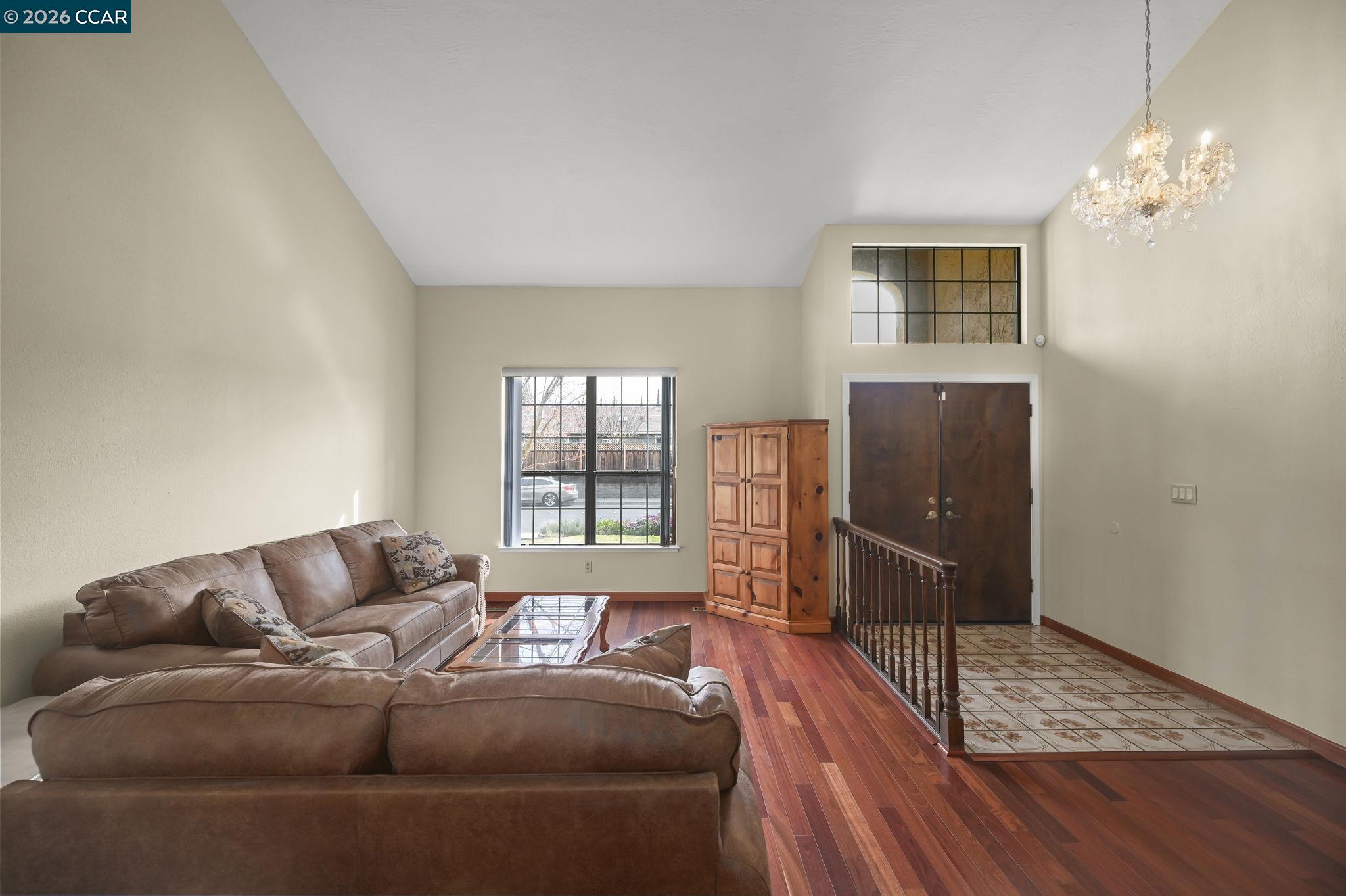 5017 Murchio Drive Concord, CA 94521 - Photo 4 of 30 a living room with furniture and a chandelier