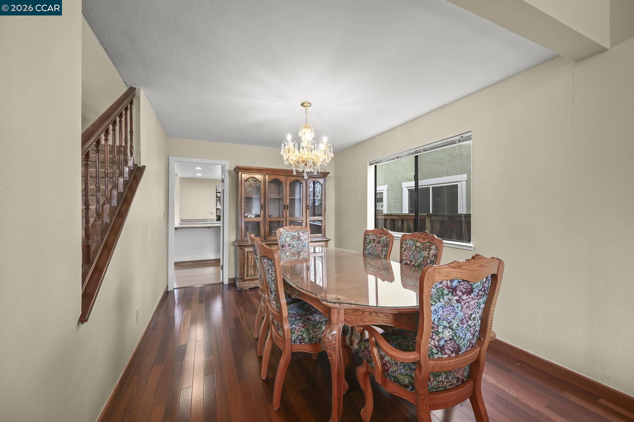 5017 Murchio Drive Concord, CA 94521 - Photo 7 of 30 a view of a dining room with furniture and wooden floor