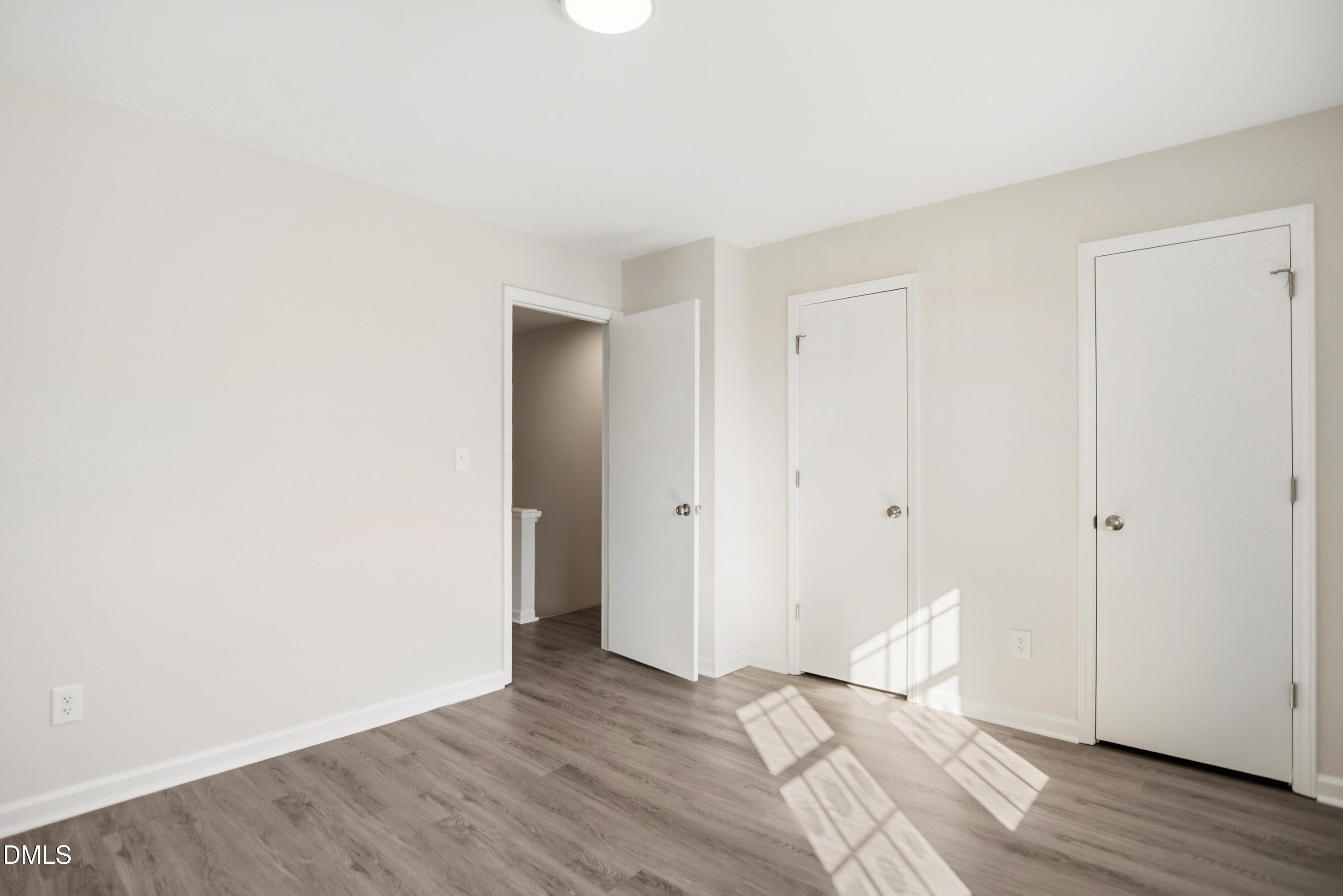 1931 Tischer Road Raleigh, NC 27603 - Photo 14 of 19 a view of an empty room and wooden floor
