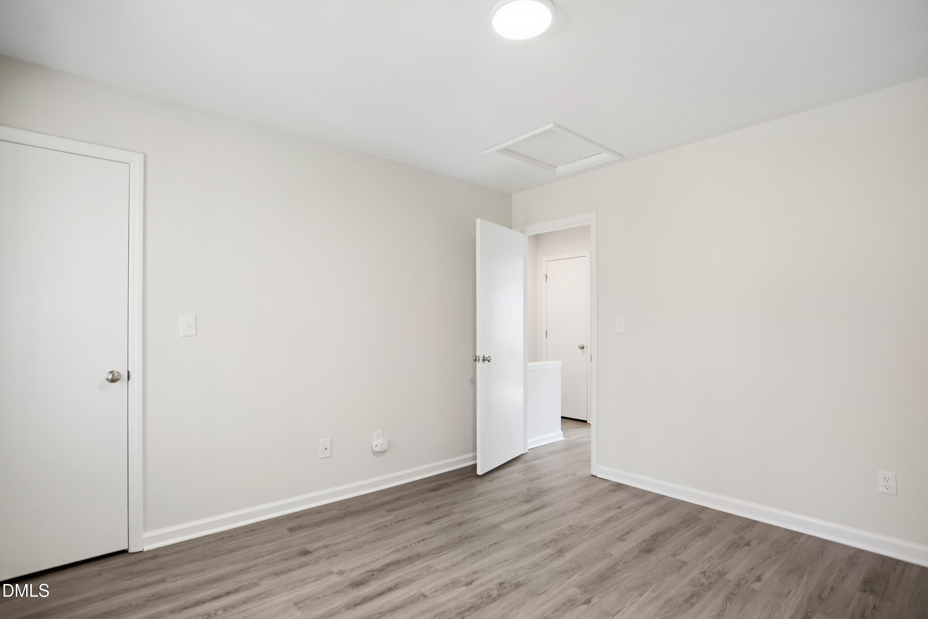 1931 Tischer Road Raleigh, NC 27603 - Photo 16 of 19 a view of an empty room with wooden floor