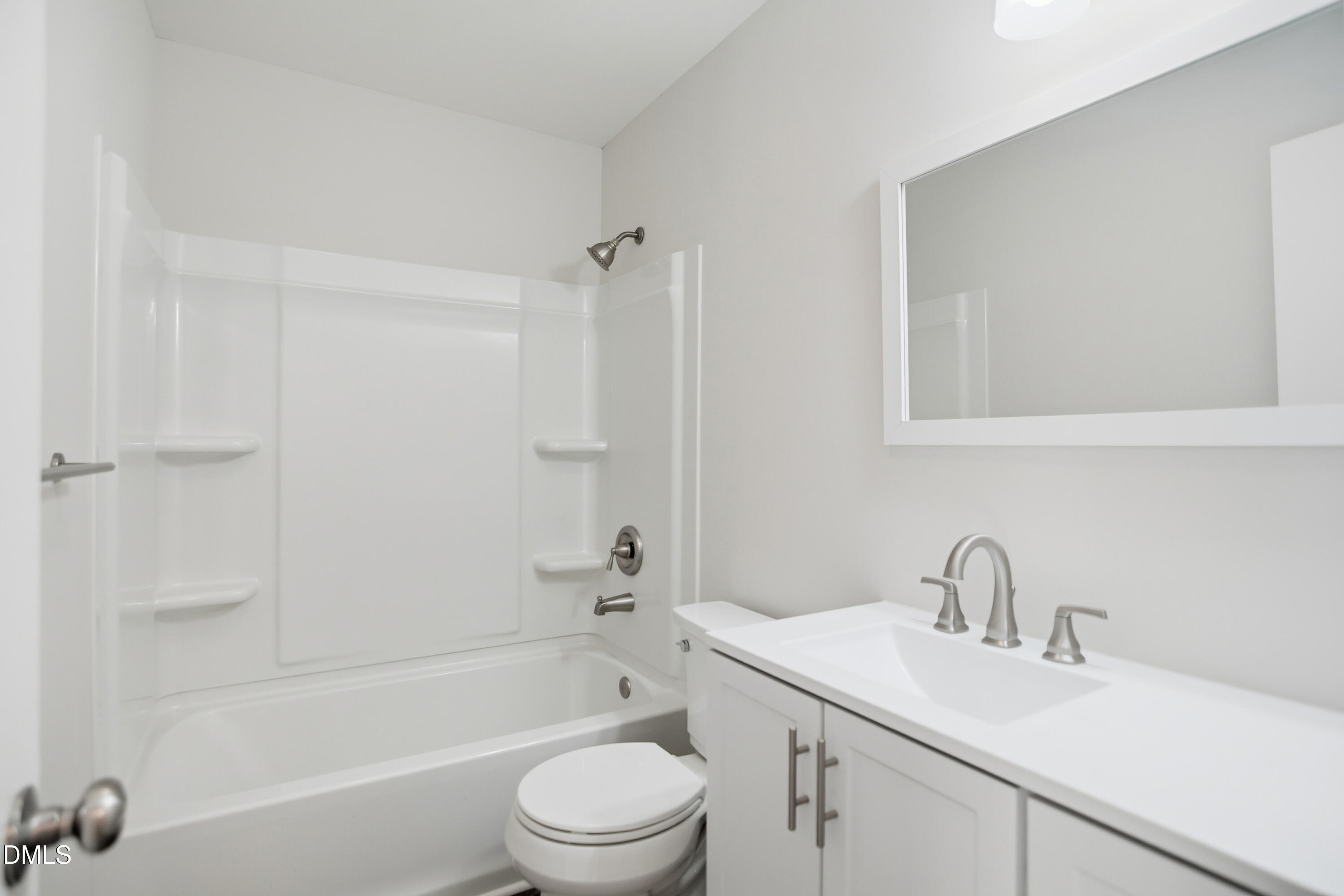 1931 Tischer Road Raleigh, NC 27603 - Photo 17 of 19 a bathroom with a sink toilet and shower