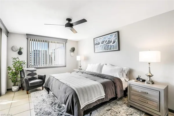 a bedroom with bed and a window