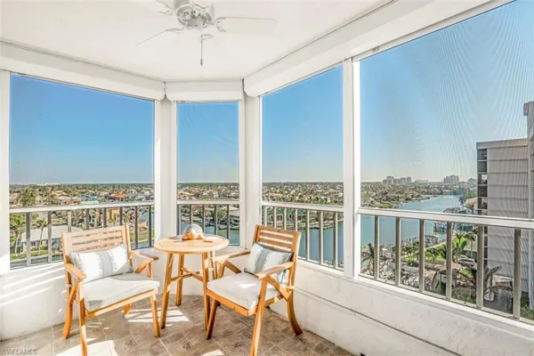 a view of a balcony with furniture
