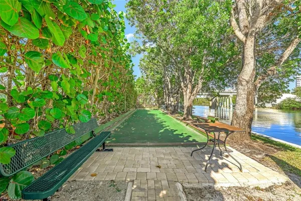 a view of a backyard with sitting area