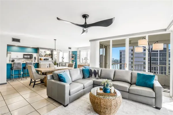 a living room with furniture and a large window