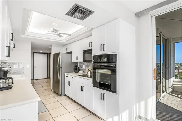 a kitchen with stainless steel appliances a stove sink and refrigerator