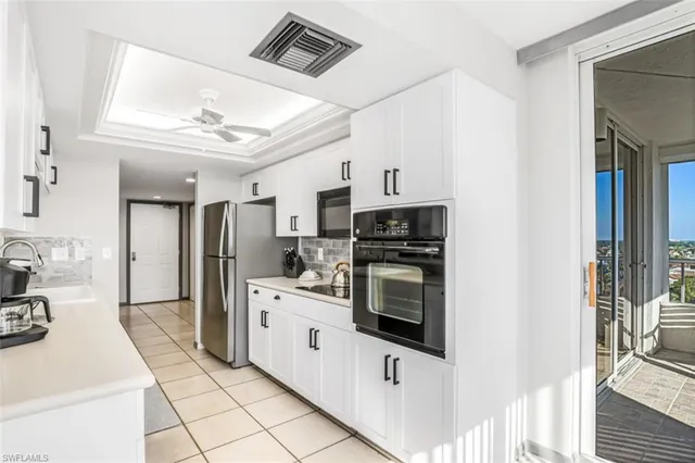 a kitchen with stainless steel appliances a stove sink and refrigerator