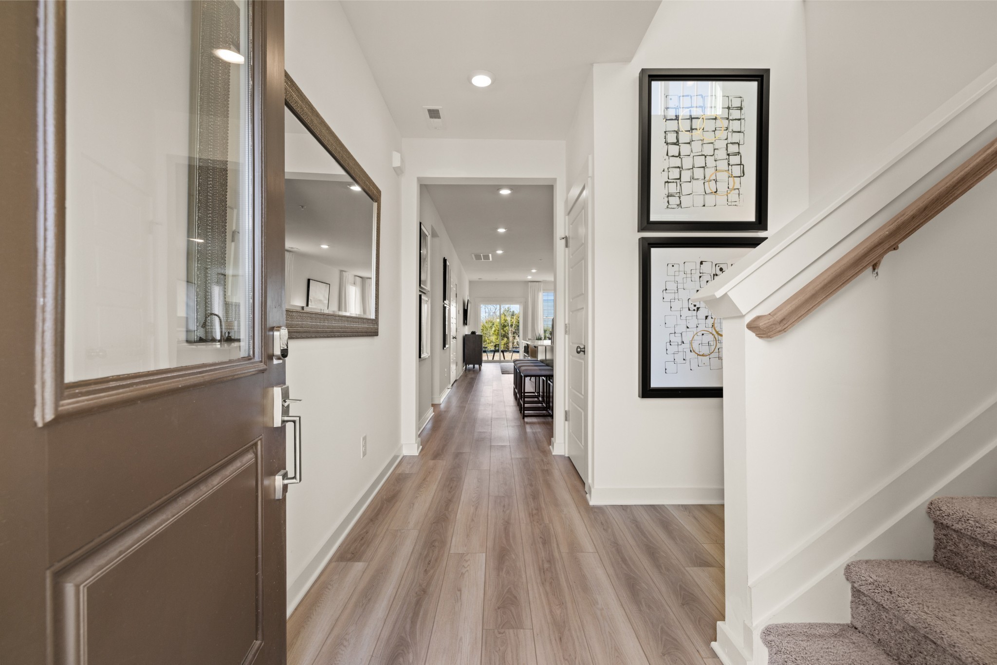 467 Alcott Way Spring Hill Spring Hill, TN 37174 - Photo 2 of 19 a view of a hallway with wooden floor and staircase