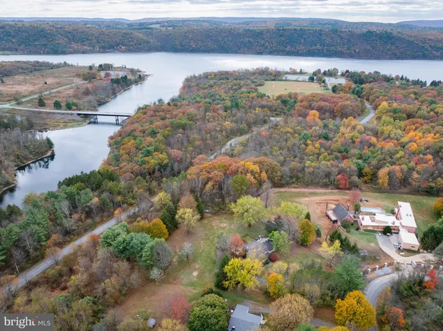a view of a livingroom with furniture and a window