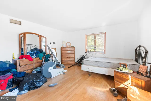 a bedroom with bed and a closet