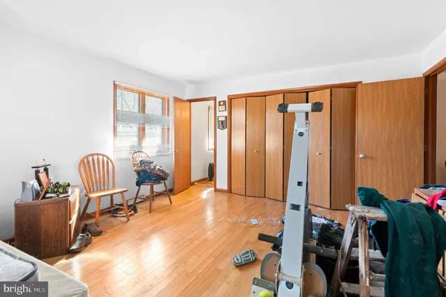 a living room with hard wood flooring and a couch