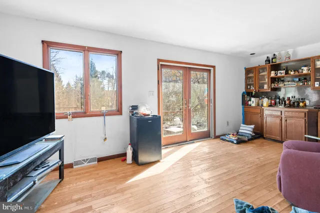 a view of a dining room with furniture window and wooden floor