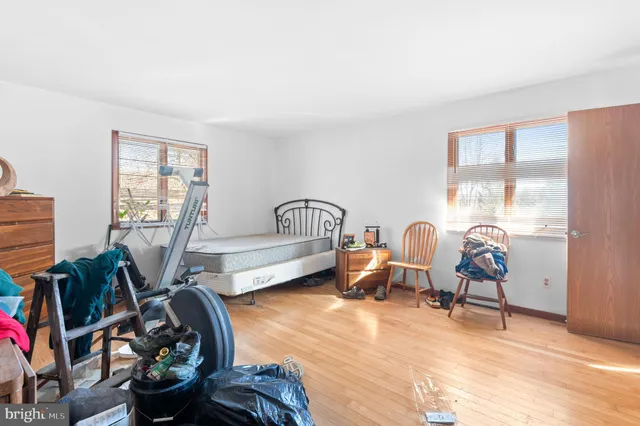 a living room with hard wood flooring and furniture