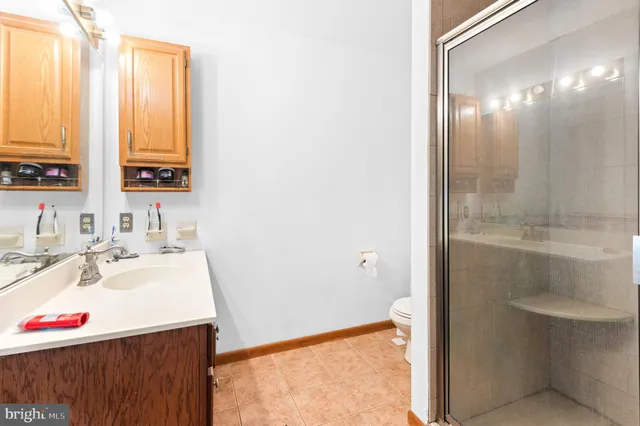 a view of a room with wooden floor and door