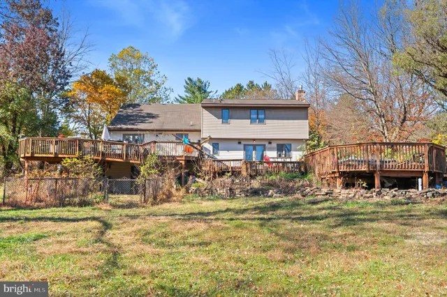 a view of a house with sitting area and furniture