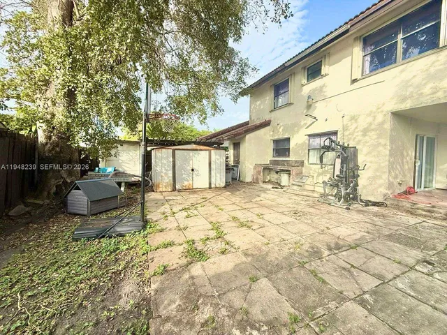 a view of a backyard of the house