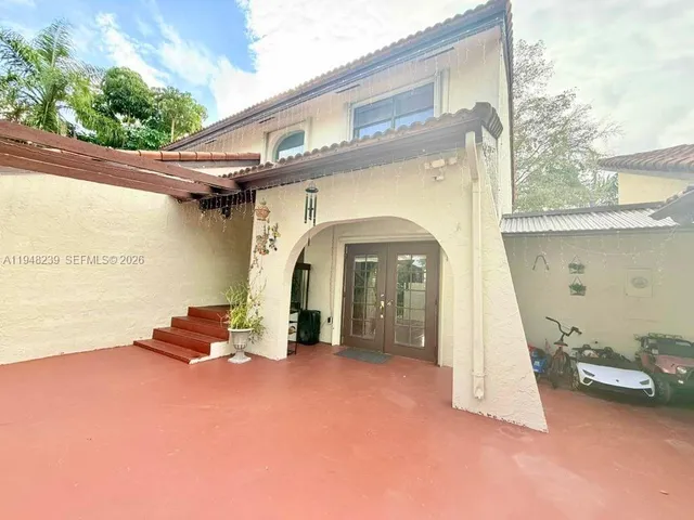 a large kitchen with cabinets and stainless steel appliances
