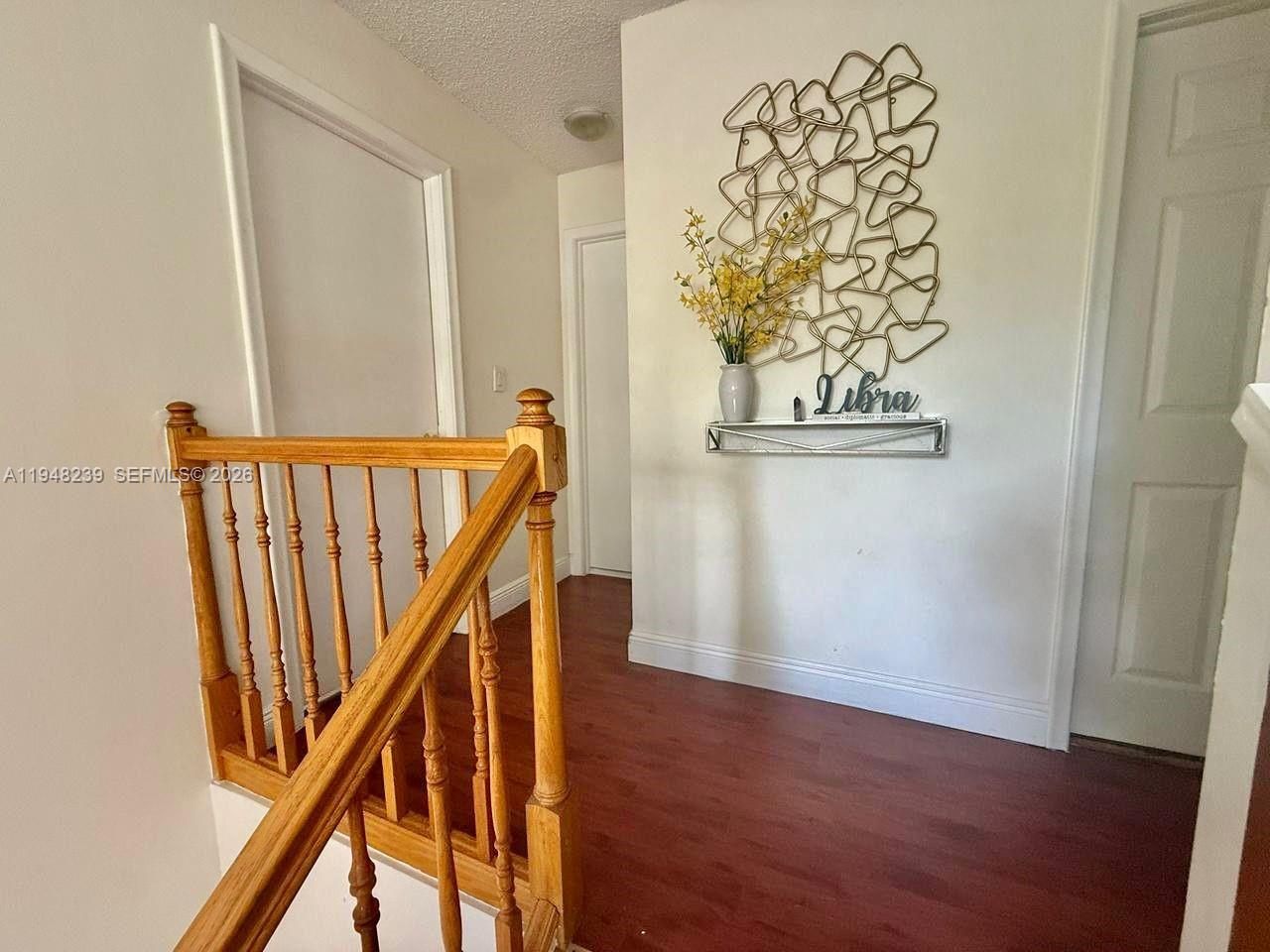 6426 Southwest 134th Place, Unit 6426 Miami, FL 33183 - Photo 5 of 20 Top of stairs walkway
