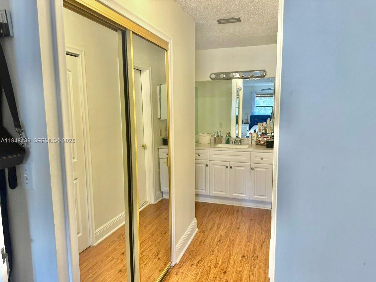 6426 Southwest 134th Place, Unit 6426 Miami, FL 33183 - Photo 7 of 20 Walkway to Primary bathroom