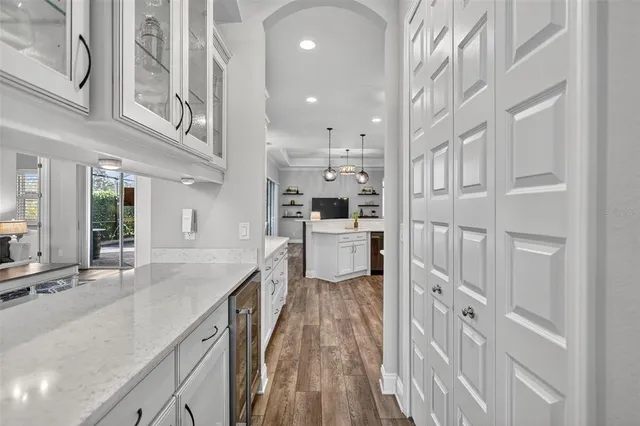 a bathroom with a sink a vanity a mirror and shower