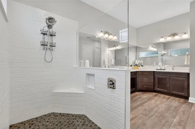 a living room with furniture a flat screen tv and a large window