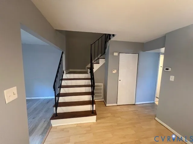 a view of entryway with wooden floor