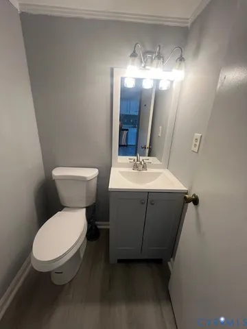 a white toilet sitting next to a bathroom sink
