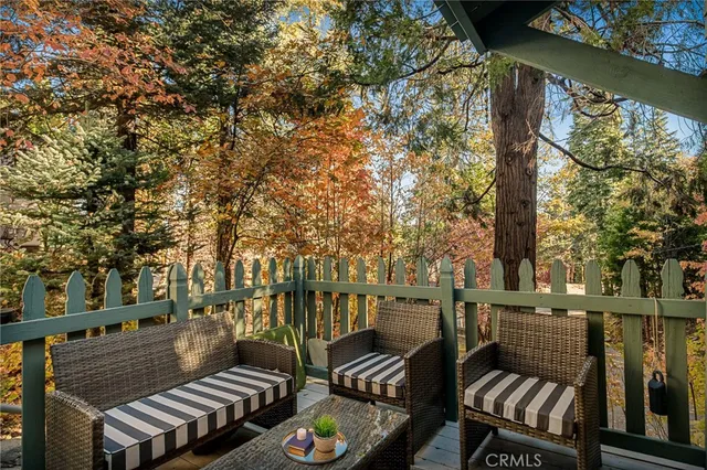 a view of a chairs and table in the balcony