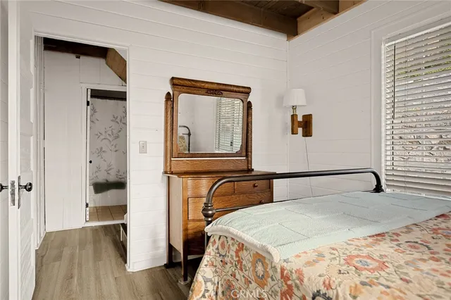 a bedroom with a bed and chair