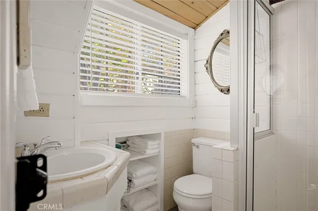 front view of a house with a bench