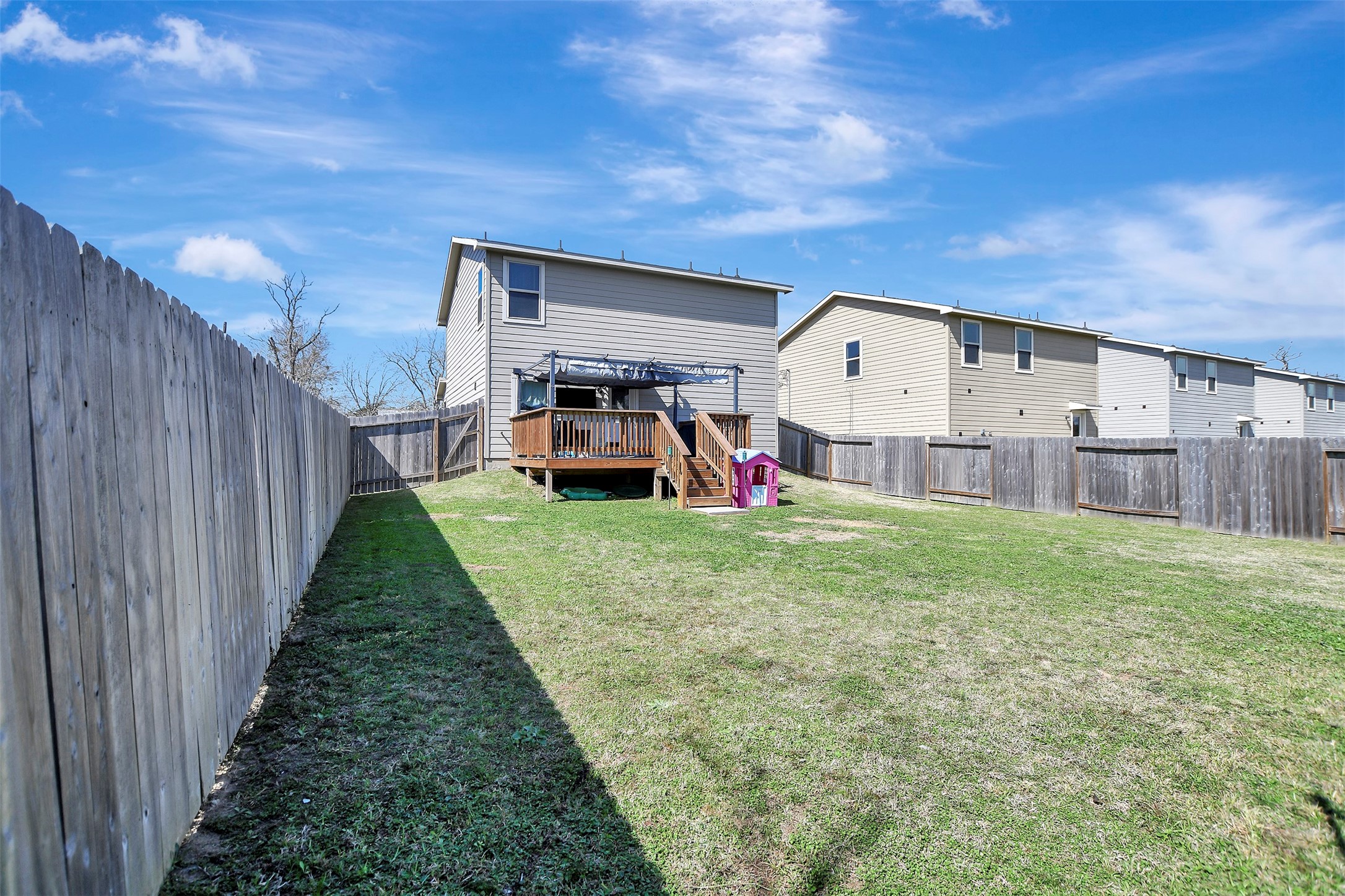 950 21st Street Hempstead, TX 77445 - Photo 34 of 35 Privacy-fenced backyard situated on the first of two lots, offering secure space for pets, play, or outdoor enjoyment.