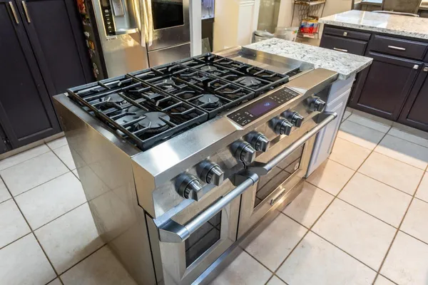 a bathroom with a granite countertop sink a large mirror and a vanity