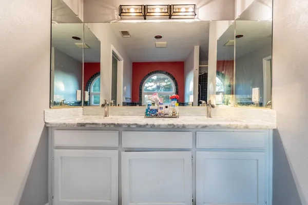 a bathroom with a shower and a sink