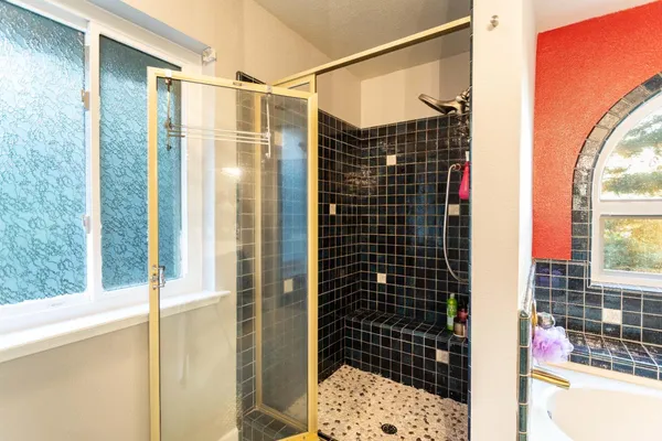 a view of a house with pool porch and sitting area